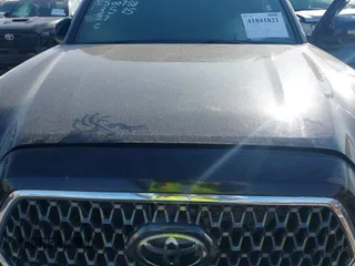 2019 Toyota Tacoma SR z VIN 5TFCZ5AN9KX199814, wystawiony jako IAAI lot #41841821 z przebiegiem 69 276 mil mil oraz . Historia ofert i sprzedaży dostępna na DreamBid. Obrazek 10.