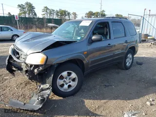 2004 Mazda Tribute LX with VIN 4F2CZ941X4KM19302, listed as a IAAI auction lot 41791389 with 123,036 mi miles. Bid and sale history available at carsss.com. Image 2.