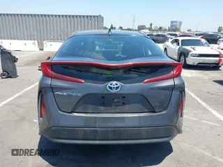 2021 Toyota Prius LE with VIN JTDKAMFPXM3170372, listed as a IAAI auction lot 42661609 with 47,977 mi miles and . Bid and sale history available at DreamBid. Image 16.