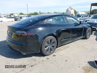 2023 Tesla Model S with VIN 5YJSA1E54PF531021, listed as a IAAI auction lot 42014104 with Not provided miles and . Bid and sale history available at DreamBid. Image 4.