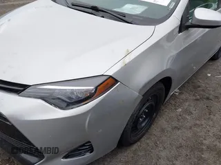 2018 Toyota Corolla L with VIN 2T1BURHE5JC007745, listed as a IAAI auction lot 42145183 with 152,661 mi miles and . Bid and sale history available at DreamBid. Image 17.