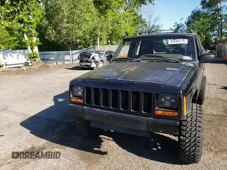 2000 Jeep Cherokee z VIN 1J4FF48S3YL180200, wystawiony jako Copart lot #55994215 z przebiegiem 209 182 mil mil oraz Szkoda całkowita • Salvage title. Historia ofert i sprzedaży dostępna na DreamBid. Obrazek 14.