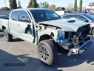 2023 Toyota Tacoma SR5 z VIN 3TMAZ5CN5PM208378, wystawiony jako IAAI lot #41382326 z przebiegiem 14 738 mil mil oraz . Historia ofert i sprzedaży dostępna na DreamBid. Obrazek 1.