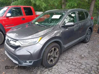 2018 Honda CR-V Touring z VIN 7FARW1H9XJE040530, wystawiony jako IAAI lot #42227446 z przebiegiem 101 299 mil mil oraz . Historia ofert i sprzedaży dostępna na DreamBid. Obrazek 2.