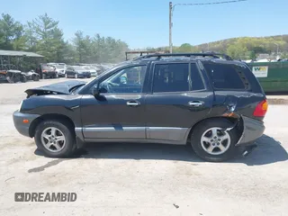 2002 Hyundai Santa Fe GLS z VIN KM8SC73D42U281993, wystawiony jako IAAI lot #42098783 z przebiegiem 256 094 mil mil oraz . Historia ofert i sprzedaży dostępna na DreamBid. Obrazek 14.