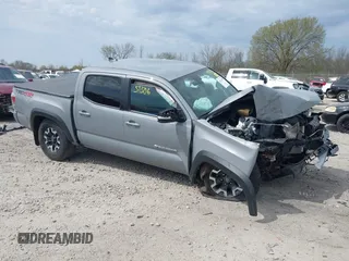 2021 Toyota Tacoma SR z VIN 5TFCZ5AN6MX281387, wystawiony jako IAAI lot #42151506 z przebiegiem 28 892 mil mil oraz . Historia ofert i sprzedaży dostępna na DreamBid. Obrazek 1.