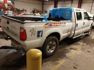 2015 Ford Super Duty F-250 SRW Lariat with VIN 1FT7W2BT2FEB23987, listed as a IAAI auction lot 41538076 with 297,010 mi miles. Bid and sale history available at carsss.com. Image 4.