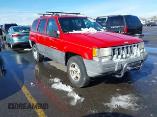 1996 Jeep Grand Cherokee Laredo with VIN 1J4GZ58Y8TC374929, listed as a IAAI auction lot 41725111 with 196,723 mi miles. Bid and sale history available at carsss.com. Image 1.