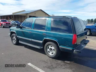1999 GMC Yukon with VIN 1GKEK13R3XJ717999, listed as a IAAI auction lot 41870187 with 179,855 mi miles. Bid and sale history available at carsss.com. Image 3.