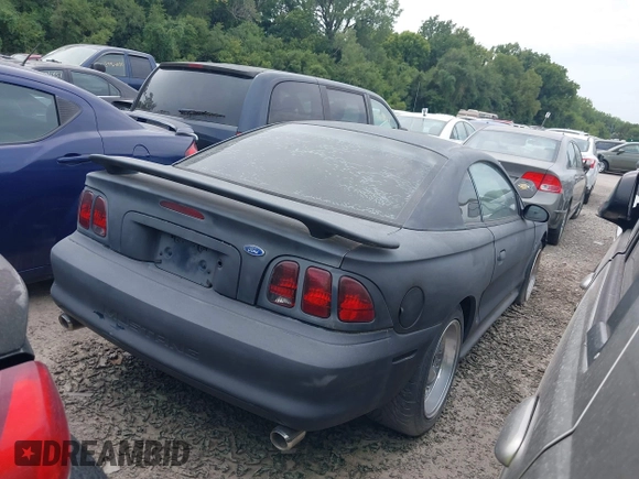 1997 Ford Mustang with VIN 1FALP4043VF158166, listed as a IAAI auction lot 39369761 with 124,992 mi miles. Bid and sale history available at carsss.com. Image 4.
