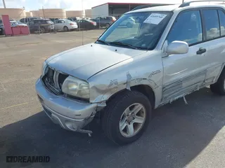 2003 Suzuki Grand Vitara with VIN JS3TE62VX34101622, listed as a IAAI auction lot 41689760 with 152,104 mi miles. Bid and sale history available at carsss.com. Image 6.