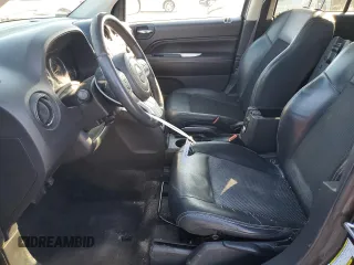 2015 Jeep Compass Latitude with VIN 1C4NJCEBXFD274712, listed as a Copart auction lot 41638375 with 142,684 mi miles and Salvage Title. Bid and sale history available at carsss.com. Image 7.