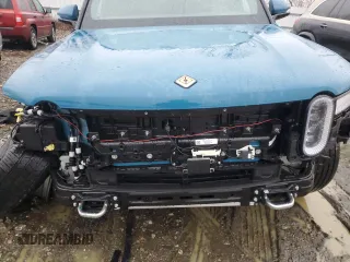 2024 Rivian R1S Adventure z VIN 7PDSGABA1RN031444, wystawiony jako Copart lot #43312765 z przebiegiem Nie podano mil oraz Szkody całkowita. Historia ofert i sprzedaży dostępna na DreamBid. Obrazek 12.
