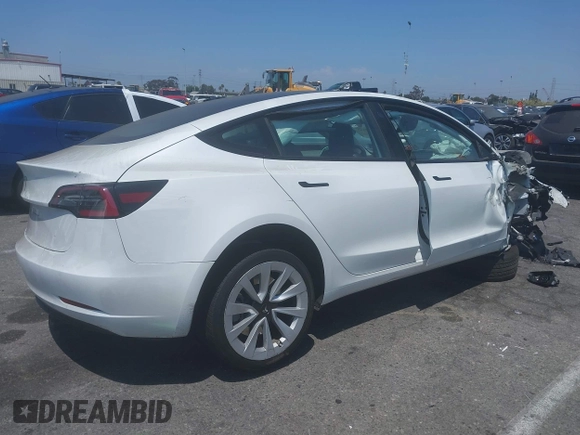 2023 Tesla Model 3 with VIN 5YJ3E1EA6PF460054, listed as a IAAI auction lot 41231368 with 29,437 mi miles and . Bid and sale history available at DreamBid. Image 4.