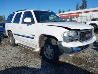 2002 GMC Yukon SLT with VIN 1GKEK13Z42R330484, listed as a IAAI auction lot 41559857 with 115,561 mi miles. Bid and sale history available at carsss.com. Image 1.