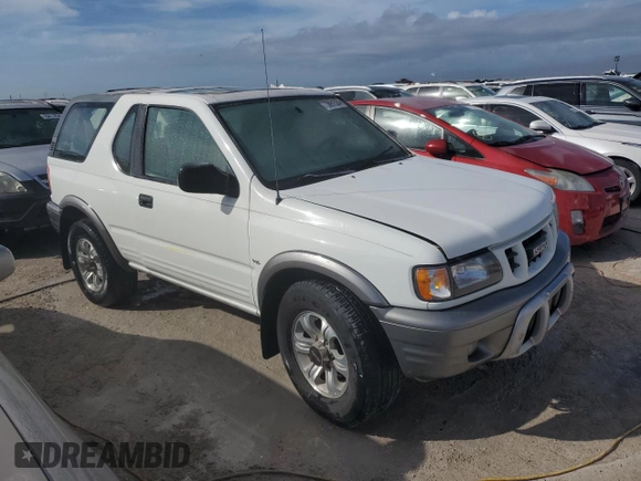 2001 Isuzu Rodeo z VIN 4S2CK57W614340766, wystawiony jako Copart lot #73891524 z przebiegiem 124 446 mil mil oraz Nie do naprawy. Historia ofert i sprzedaży dostępna na DreamBid. Obrazek 4.