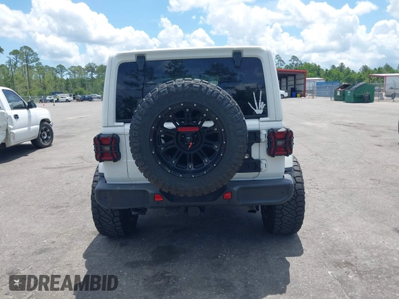 2021 Jeep Wrangler Unlimited Sahara Altitude z VIN 1C4HJXEN7MW518395, wystawiony jako IAAI lot #42484314 z przebiegiem 55 000 mil mil oraz . Historia ofert i sprzedaży dostępna na DreamBid. Obrazek 16.