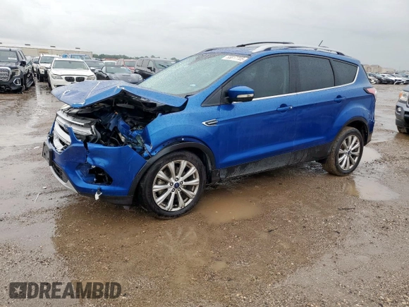 2018 Ford Escape Titanium with VIN 1FMCU9J98JUB31234, listed as a Copart auction lot 58817705 with 140,183 mi miles and Salvage title. Bid and sale history available at DreamBid. Image 1.