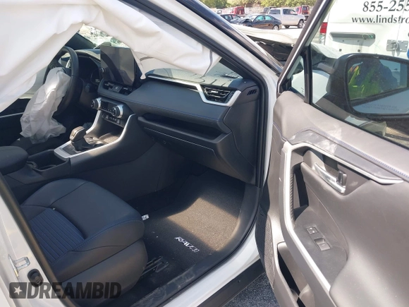 2024 Toyota RAV4 Hybrid XSE with VIN 2T3E6RFV9RW077941, listed as a IAAI auction lot 42012134 with 31,009 mi miles and . Bid and sale history available at DreamBid. Image 5.