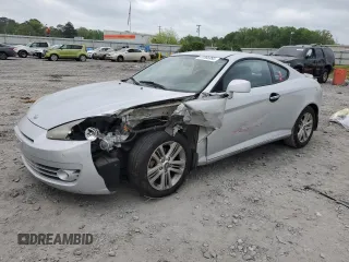2008 Hyundai Tiburon GS z VIN KMHHM66DX8U288114, wystawiony jako Copart lot #51866995 z przebiegiem Nie podano mil oraz Szkoda całkowita • Salvage title. Historia ofert i sprzedaży dostępna na DreamBid. Obrazek 1.