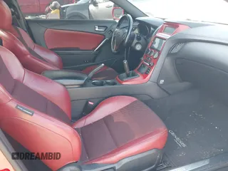 2013 Hyundai Genesis Coupe Track z VIN KMHHU6KJ4DU098623, wystawiony jako IAAI lot #41562667 z przebiegiem 120 690 mil mil oraz . Historia ofert i sprzedaży dostępna na DreamBid. Obrazek 5.