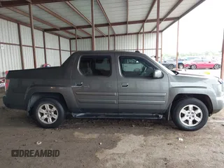 2007 Honda Ridgeline RTL z VIN 2HJYK16537H521608, wystawiony jako IAAI lot #42112626 z przebiegiem 197 076 mil mil oraz . Historia ofert i sprzedaży dostępna na DreamBid. Obrazek 13.