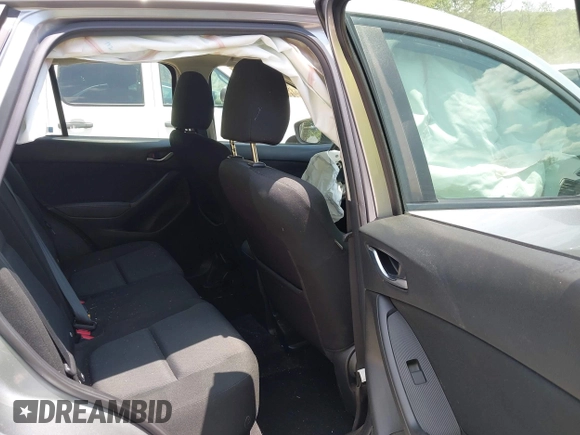 2014 Mazda CX-5 Sport with VIN JM3KE2BEXE0329303, listed as a IAAI auction lot 42556908 with 127,836 mi miles and . Bid and sale history available at DreamBid. Image 8.