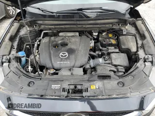 2020 Mazda CX-5 Touring with VIN JM3KFBCM1L0792706, listed as a Copart auction lot 73032144 with 56,845 mi miles and Salvage Title. Bid and sale history available at carsss.com. Image 12.