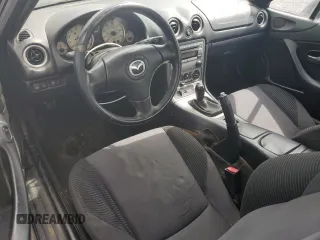2005 Mazda MX-5 Miata LS with VIN JM1NB353X50410655, listed as a Copart auction lot 63337515 with 118,409 mi miles and Clean title. Bid and sale history available at DreamBid. Image 8.