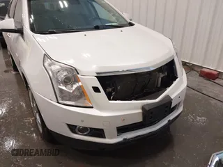 2012 Cadillac SRX Premium Collection z VIN 3GYFNFE38CS591123, wystawiony jako IAAI lot #41827636 z przebiegiem 143 867 mil mil oraz . Historia ofert i sprzedaży dostępna na DreamBid. Obrazek 6.