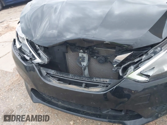 2018 Nissan Sentra S with VIN 3N1AB7AP2JY233794, listed as a IAAI auction lot 41855577 with 103,724 mi miles and . Bid and sale history available at DreamBid. Image 6.