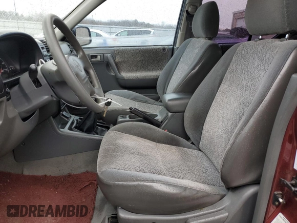 2002 Isuzu Rodeo z VIN 4S2CK58D124323937, wystawiony jako Copart lot #86155194 z przebiegiem 184 491 mil mil oraz Szkoda całkowita • Salvage title. Historia ofert i sprzedaży dostępna na DreamBid. Obrazek 7.