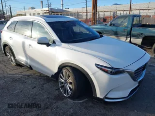 2021 Mazda CX-9 Signature with VIN JM3TCBEY6M0536883, listed as a IAAI auction lot 41388130 with 65,613 mi miles. Bid and sale history available at carsss.com. Image 1.