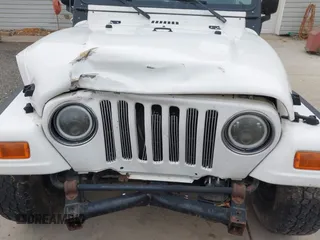 2005 Jeep Wrangler Sport with VIN 1J4FA49S25P352170, listed as a IAAI auction lot 41794958 with 154,304 mi miles. Bid and sale history available at carsss.com. Image 6.