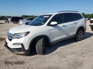 2021 Honda Pilot Touring 7-Passenger z VIN 5FNYF5H63MB027322, wystawiony jako Copart lot #56532625 z przebiegiem 63 318 mil mil oraz Szkoda całkowita • Salvage title. Historia ofert i sprzedaży dostępna na DreamBid. Obrazek 1.
