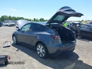 2022 Tesla Model Y Long Range with VIN 7SAYGDEE7NF426404, listed as a IAAI auction lot 42040490 with 39,635 mi miles and . Bid and sale history available at carsss.com. Image 3.