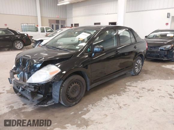 2009 Nissan Versa 1.8 S with VIN 3N1BC11E99L438342, listed as a IAAI auction lot 41561812 with 152,141 mi miles. Bid and sale history available at carsss.com. Image 20.