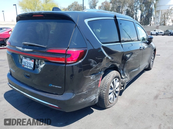 2021 Chrysler Pacifica Hybrid Touring L with VIN 2C4RC1L71MR599631, listed as a IAAI auction lot 42151965 with 67,401 mi miles and . Bid and sale history available at DreamBid. Image 4.