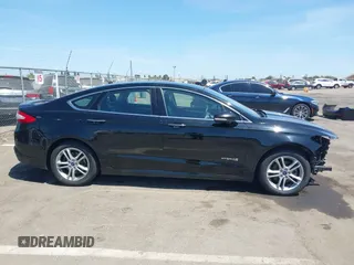 2016 Ford Fusion Titanium Hybrid z VIN 3FA6P0RUXGR123445, wystawiony jako IAAI lot #42606596 z przebiegiem 145 541 mil mil oraz . Historia ofert i sprzedaży dostępna na DreamBid. Obrazek 14.