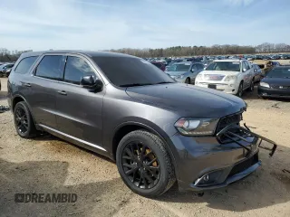 2015 Dodge Durango R/T with VIN 1C4SDHCT7FC799266, listed as a Copart auction lot 47827625 with 150,143 mi miles and Salvage Title. Bid and sale history available at DreamBid. Image 4.