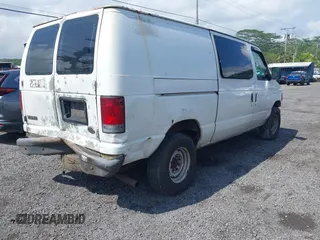 2005 Ford Econoline Cargo with VIN 1FTNE24W55HA43243, listed as a IAAI auction lot 41528626 with 240,685 mi miles and . Bid and sale history available at carsss.com. Image 4.