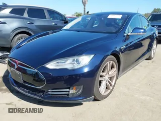 2013 Tesla Model S with VIN 5YJSA1CNXDFP28192, listed as a IAAI auction lot 42227521 with 60,967 mi miles and . Bid and sale history available at DreamBid. Image 2.