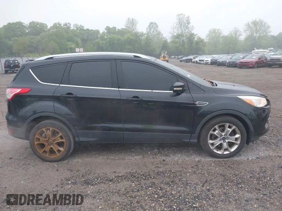 2014 Ford Escape Titanium with VIN 1FMCU9J90EUC24898, listed as a IAAI auction lot 42166523 with 152,464 mi miles and . Bid and sale history available at DreamBid. Image 13.