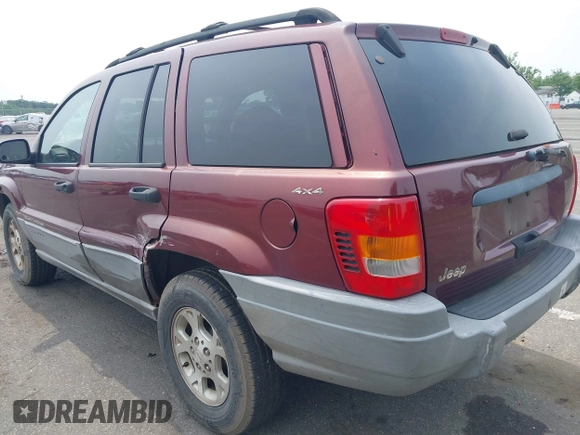 2000 Jeep Grand Cherokee Laredo z VIN 1J4GW48S2YC288439, wystawiony jako IAAI lot #42492798 z przebiegiem 272 527 mil mil oraz . Historia ofert i sprzedaży dostępna na DreamBid. Obrazek 3.