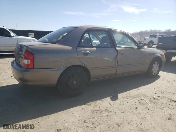2000 Mazda Protege DX with VIN JM1BJ2227Y0247785, listed as a Copart auction lot 43501105 with 214,380 mi miles and Salvage Title. Bid and sale history available at carsss.com. Image 3.