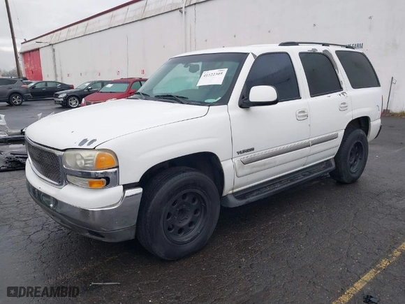 2003 GMC Yukon SLT with VIN 1GKEC13T73R281551, listed as a IAAI auction lot 41522305 with 214,489 mi miles. Bid and sale history available at carsss.com. Image 2.