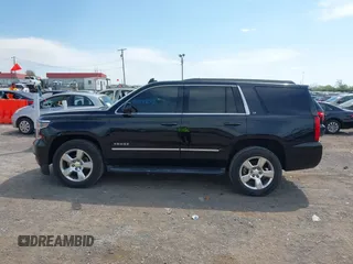 2015 Chevrolet Tahoe LT with VIN 1GNSCBKC9FR679748, listed as a IAAI auction lot 42018017 with 224,264 mi miles and . Bid and sale history available at DreamBid. Image 14.
