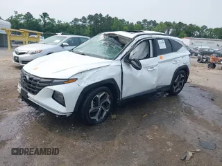 2022 Hyundai Tucson SEL z VIN 5NMJC3AE3NH057663, wystawiony jako IAAI lot #42428386 z przebiegiem 78 740 mil mil oraz . Historia ofert i sprzedaży dostępna na DreamBid. Obrazek 2.