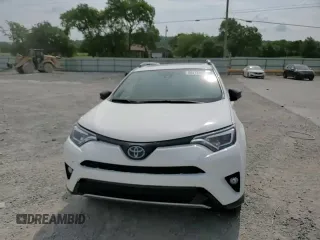 2018 Toyota RAV4 Hybrid SE with VIN JTMJJREVXJD212926, listed as a Copart auction lot 60215465 with 71,876 mi miles and Salvage title. Bid and sale history available at DreamBid. Image 14.