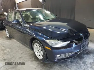 2014 BMW 3 Series 320i xDrive with VIN WBA3C3C55EF985863, listed as a IAAI auction lot 41865240 with 127,077 mi miles. Bid and sale history available at carsss.com. Image 1.